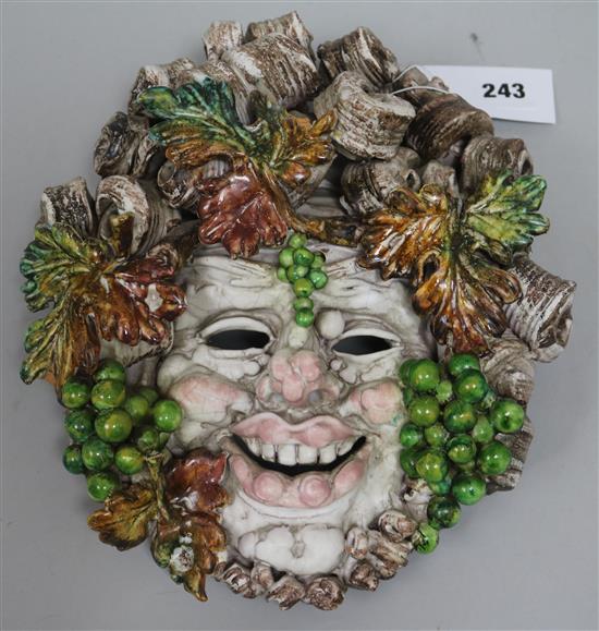 An Austrian tinglazed terracotta Bacchus mask